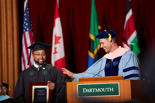 Jonathan Smith, MPH'18 receiving The Dartmouth Institute Leadership Award from Executive Director of Education Craig Westling.