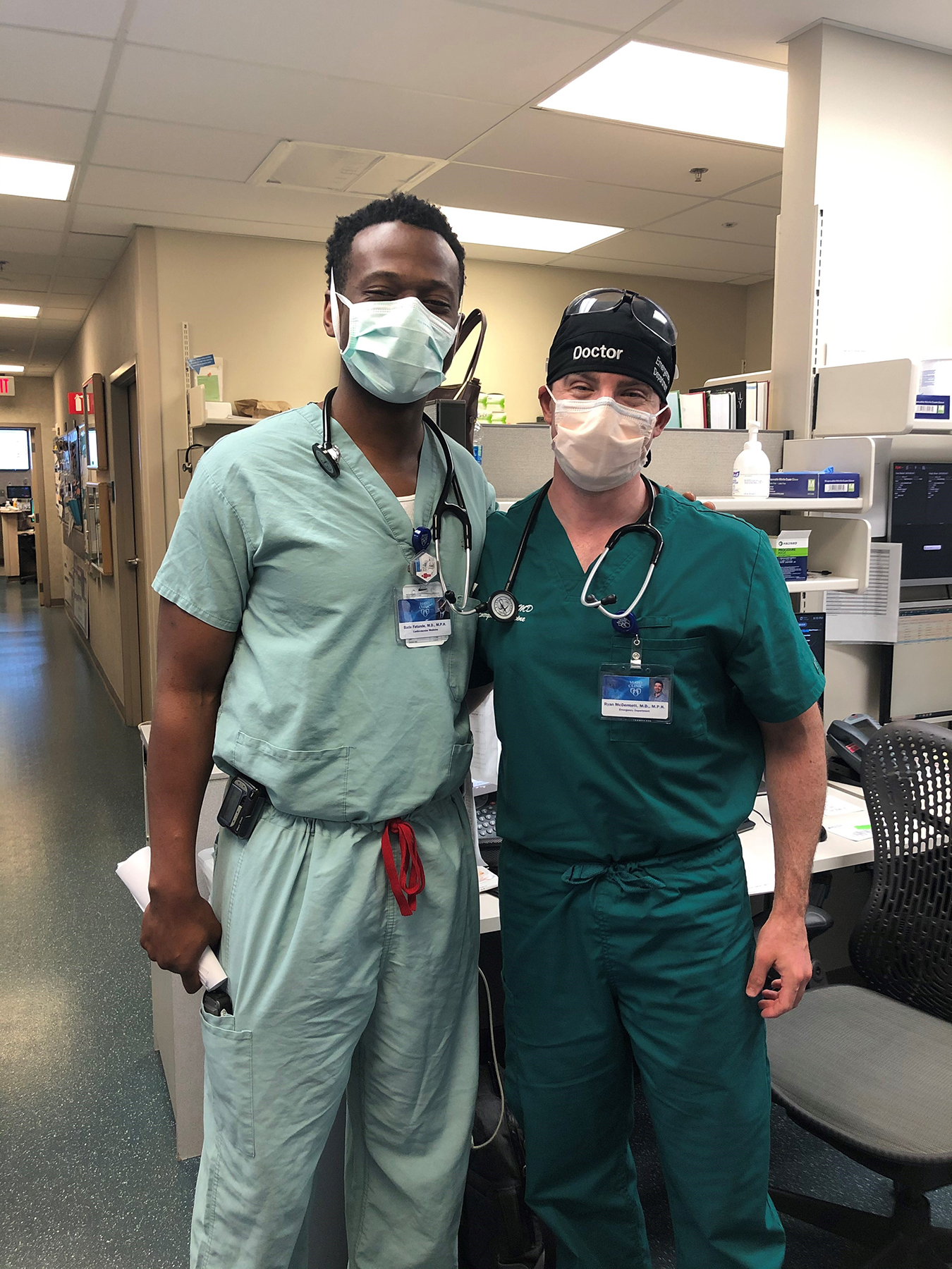 MPH classmates Bade Fatunde (left) and Ryan McDermott (right) from the class of 2008, ran into each other in the Mayo Clinic Arizona ED.